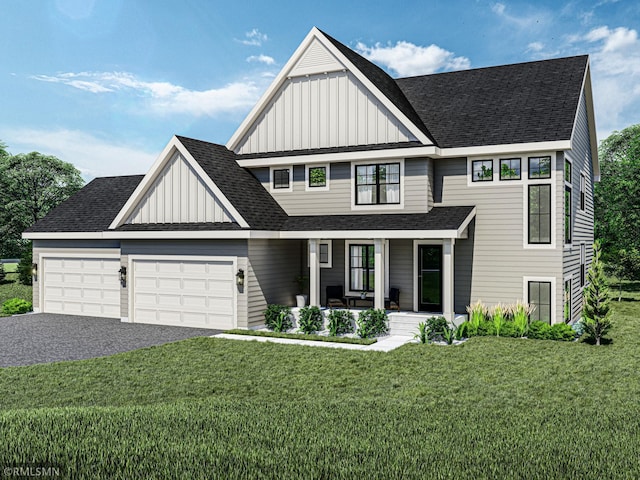 view of front of home featuring a front lawn, a garage, and a porch