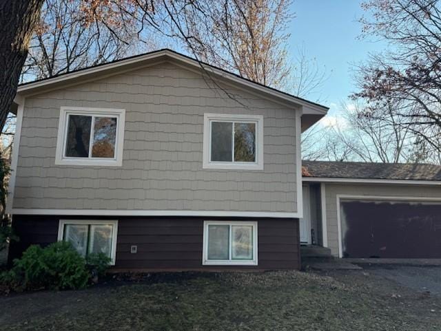 view of side of property with a garage