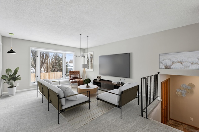 living room with light colored carpet and a textured ceiling