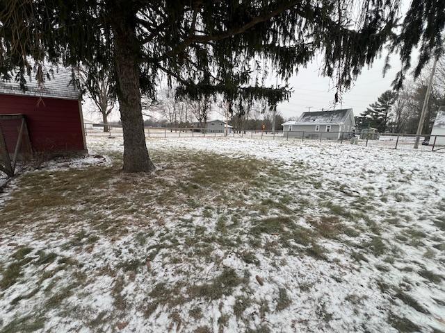 view of yard layered in snow