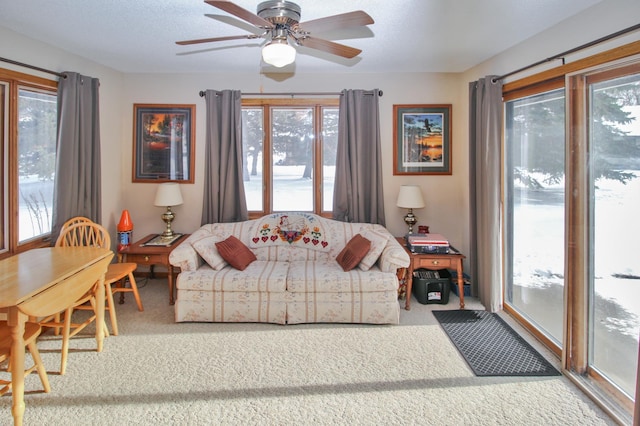 living room with carpet floors and ceiling fan