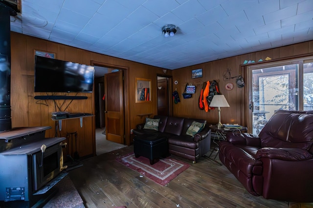 23790 360th St, Huntersville Twp, MN 56464 - living room featuring wood walls, dark hardwood / wood-style floors, and a wood stove