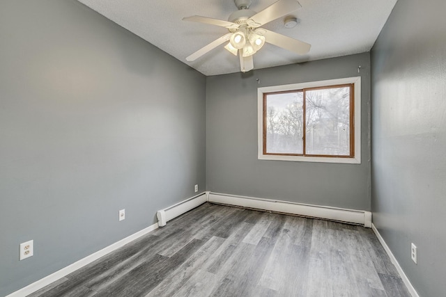 unfurnished room with light wood-type flooring, baseboards, a baseboard heating unit, and ceiling fan