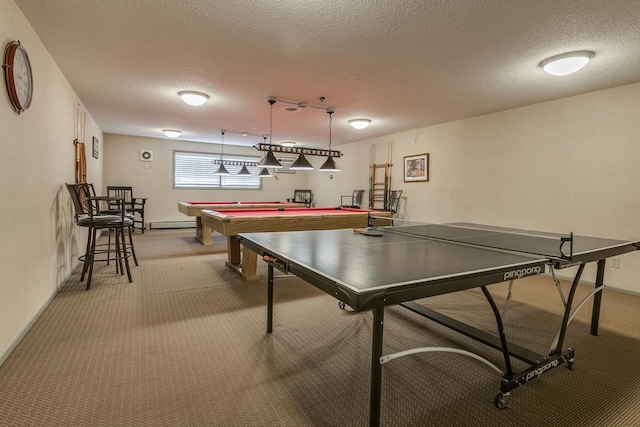 playroom featuring billiards, baseboards, a baseboard radiator, a textured ceiling, and carpet flooring