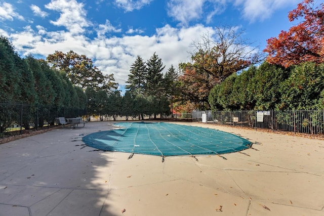 pool featuring a patio and fence