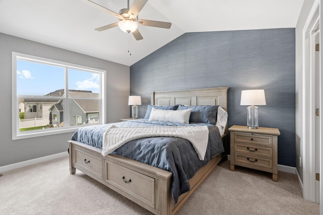 carpeted bedroom featuring vaulted ceiling and ceiling fan