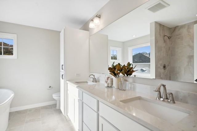 full bathroom with vanity, toilet, tile patterned flooring, and plus walk in shower