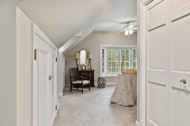 carpeted bedroom with ceiling fan and vaulted ceiling