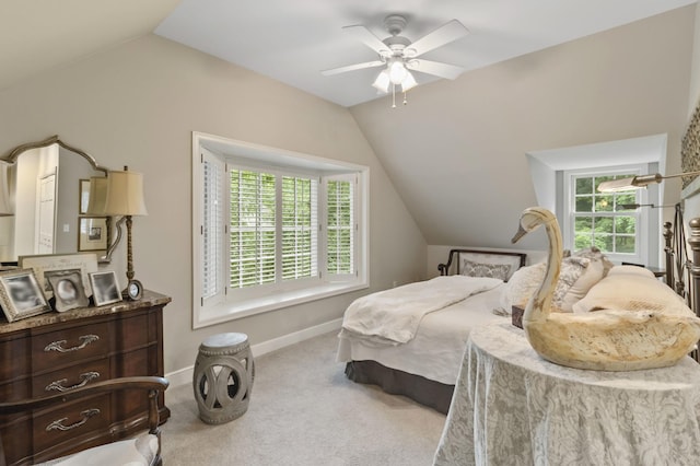 carpeted bedroom with ceiling fan and lofted ceiling