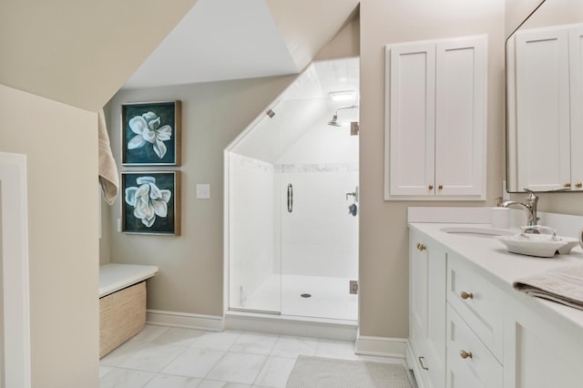 bathroom with walk in shower and vanity