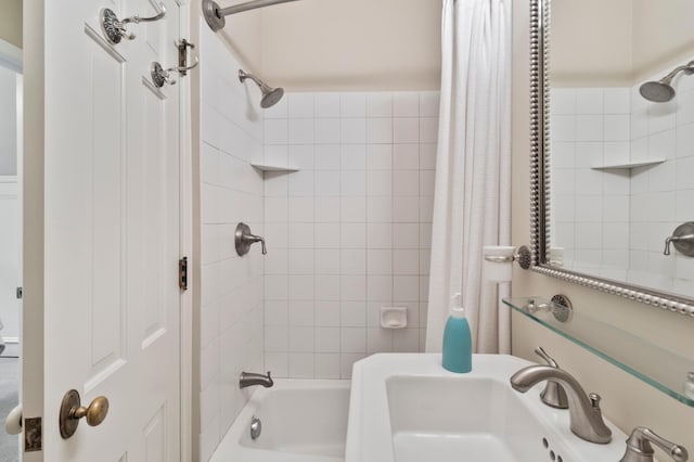 bathroom featuring shower / bath combo and sink