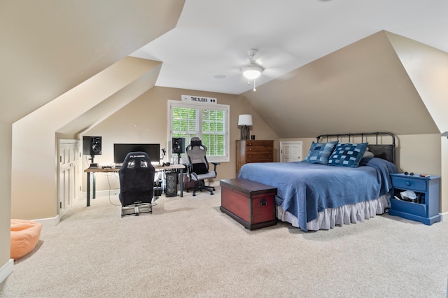 bedroom with ceiling fan, carpet floors, and lofted ceiling