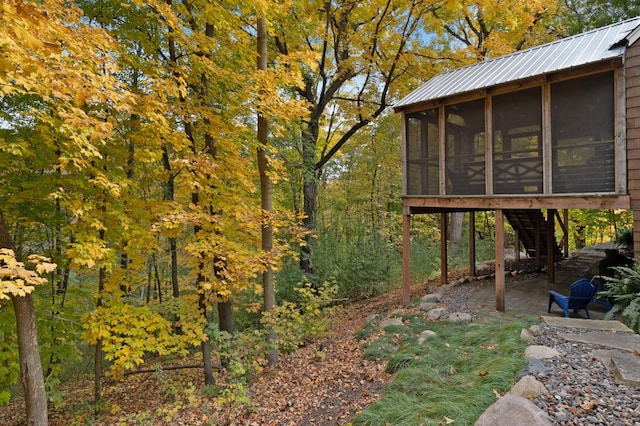 view of yard with a patio area and a sunroom