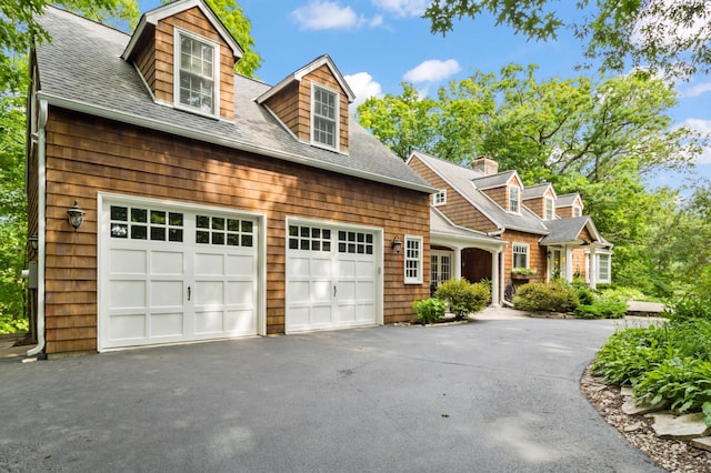 cape cod-style house with a garage