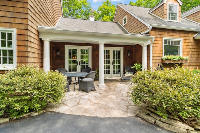 property entrance with french doors and a patio area