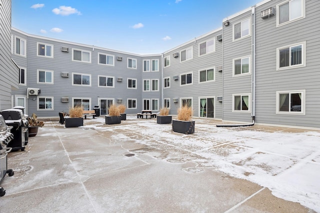 exterior space featuring a wall mounted air conditioner