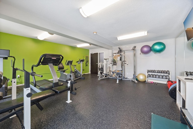 workout area with a textured ceiling