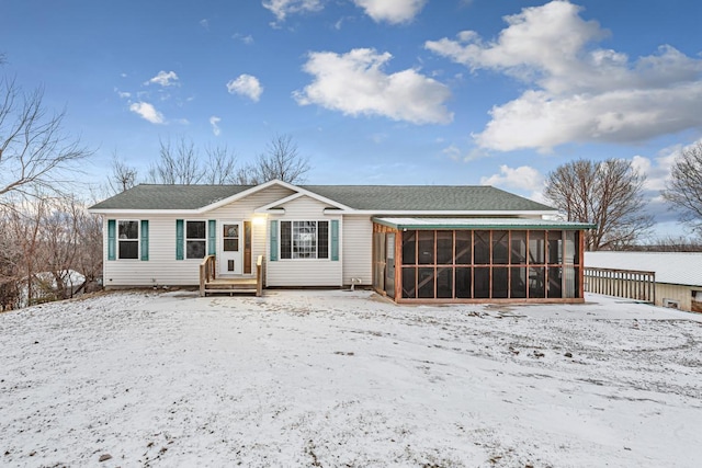 view of front of home with a sunroom