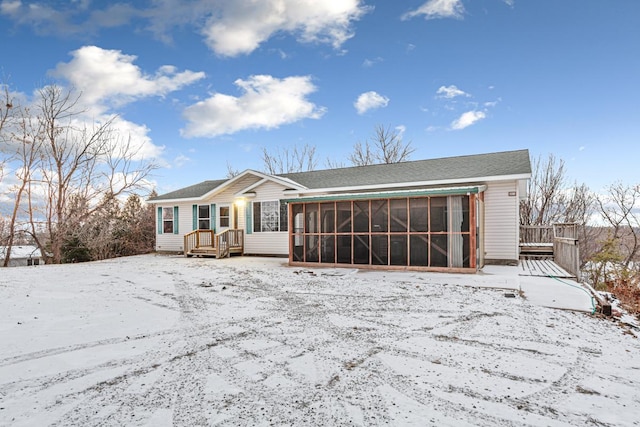 view of front of property with a sunroom