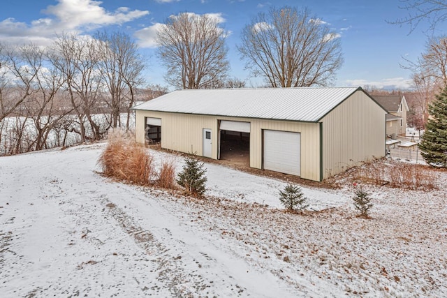 view of snow covered garage