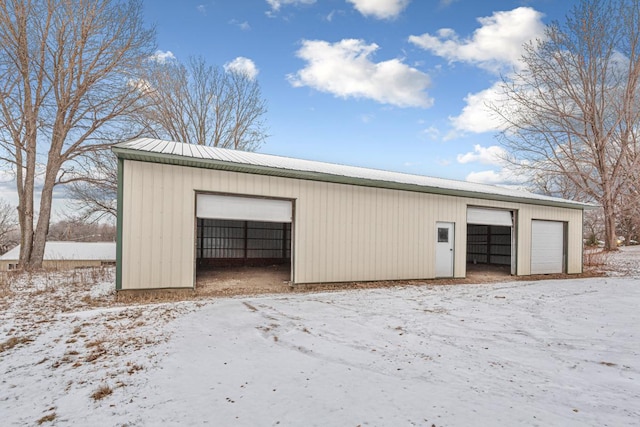 view of snow covered garage