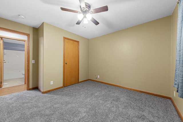 unfurnished bedroom with ceiling fan, carpet, and a closet