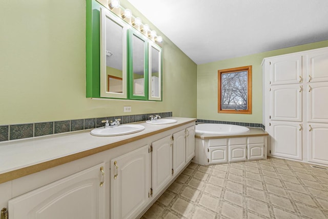 bathroom with vanity and a bathing tub