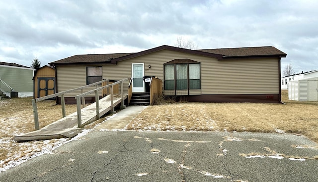 manufactured / mobile home with a storage shed