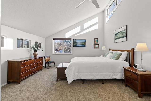 carpeted bedroom with a textured ceiling, baseboards, and lofted ceiling