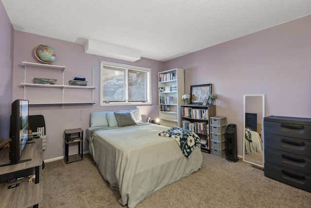 carpeted bedroom with baseboards