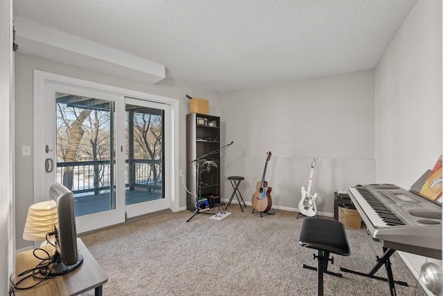 home office with carpet flooring, a textured ceiling, and baseboards