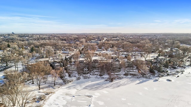 snowy aerial view featuring a residential view