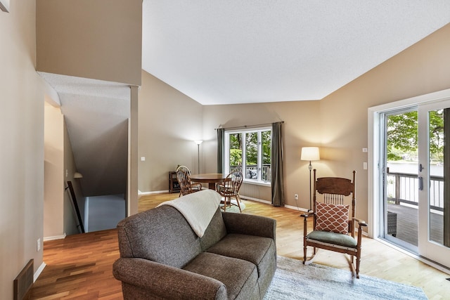 16164 Lakeside Ave SE, Prior Lake, MN 55372 - living room with lofted ceiling, light wood-style floors, and baseboards