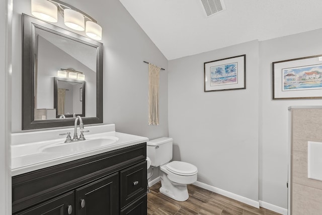 16164 Lakeside Ave SE, Prior Lake, MN 55372 - half bath with toilet, wood finished floors, lofted ceiling, vanity, and baseboards