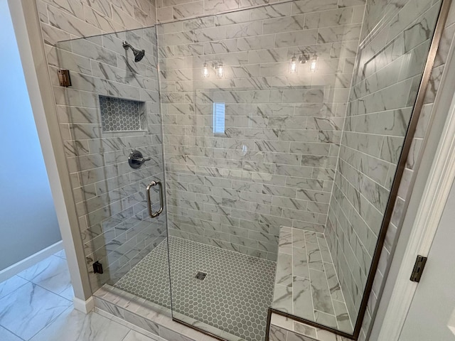 bathroom featuring a shower with door