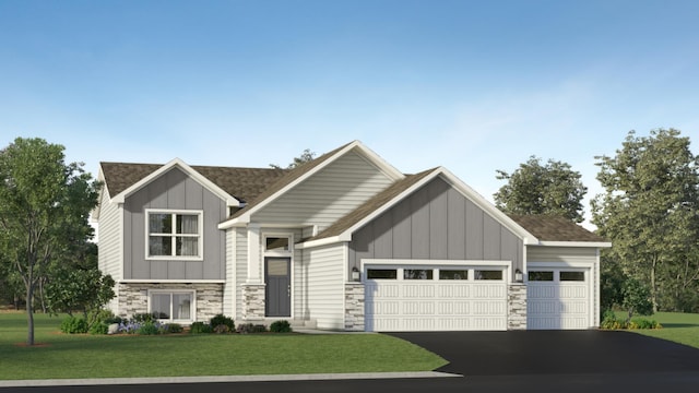 view of front facade featuring a front yard and a garage