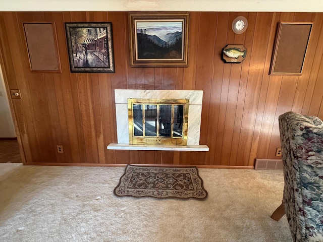 living room with carpet flooring and wooden walls