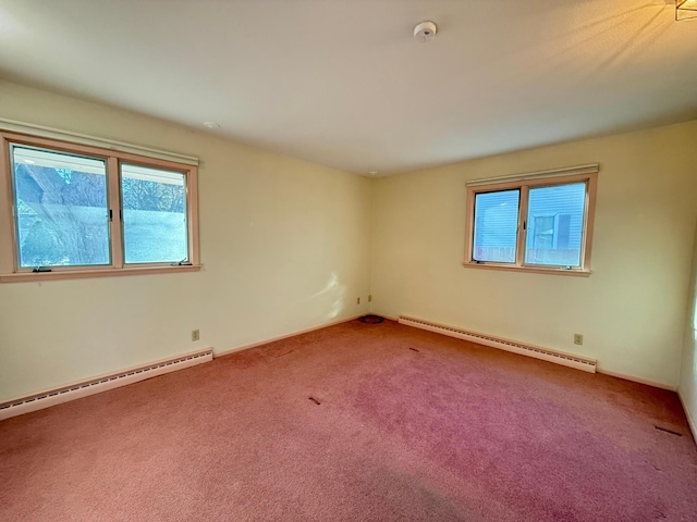 carpeted empty room featuring a baseboard radiator