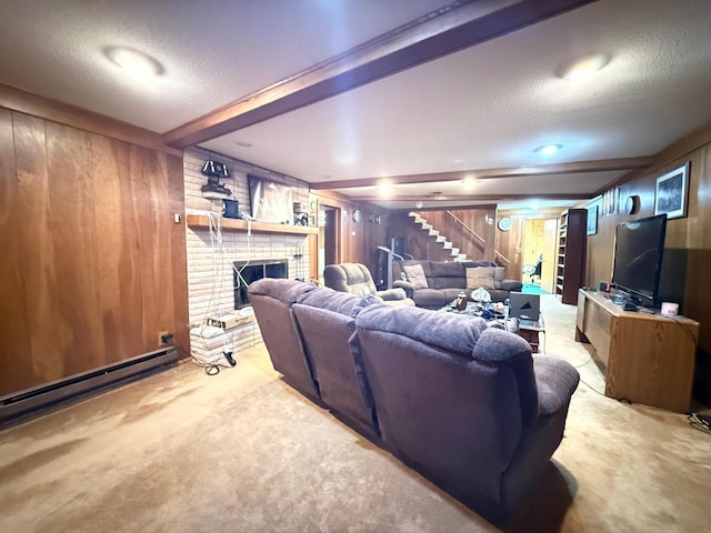 carpeted living room with a fireplace, wood walls, beamed ceiling, a baseboard radiator, and a textured ceiling