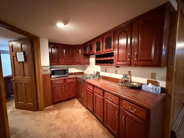 kitchen with butcher block counters and sink