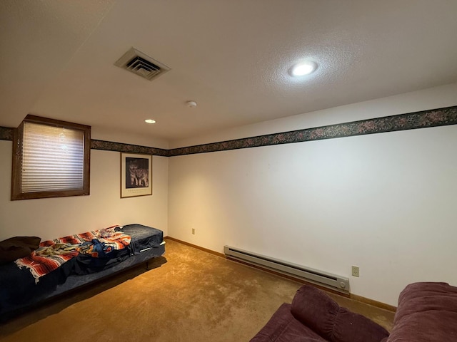 carpeted home theater room featuring baseboard heating