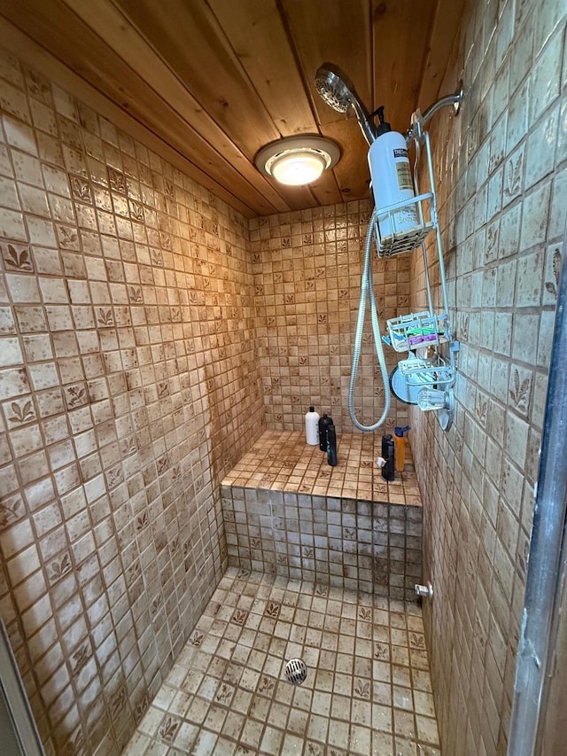 bathroom with walk in shower and wood ceiling