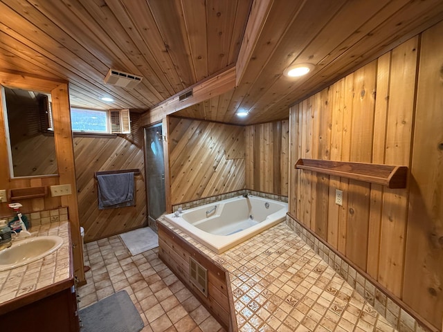 bathroom with vanity, wooden ceiling, a bathing tub, and wood walls