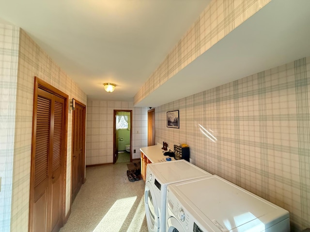 washroom featuring washing machine and clothes dryer