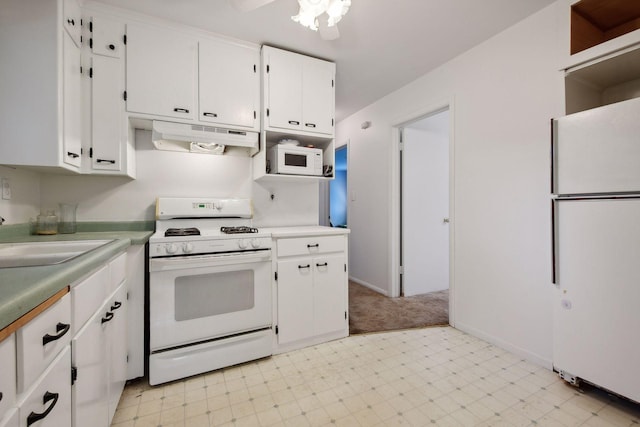 kitchen featuring ceiling fan, sink, white cabinets, and white appliances