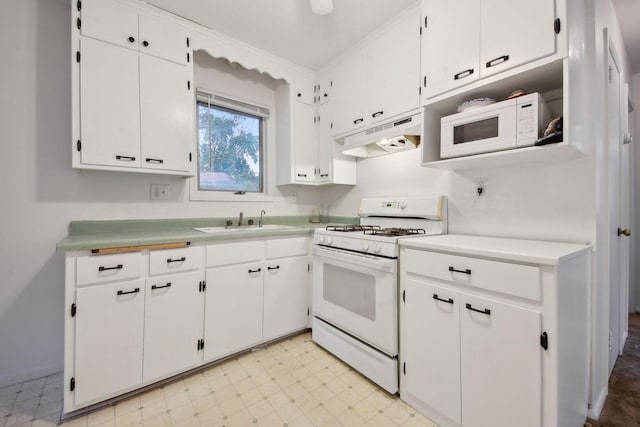 kitchen with white cabinetry, sink, and white appliances