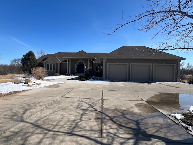 view of front of home featuring driveway and an attached garage