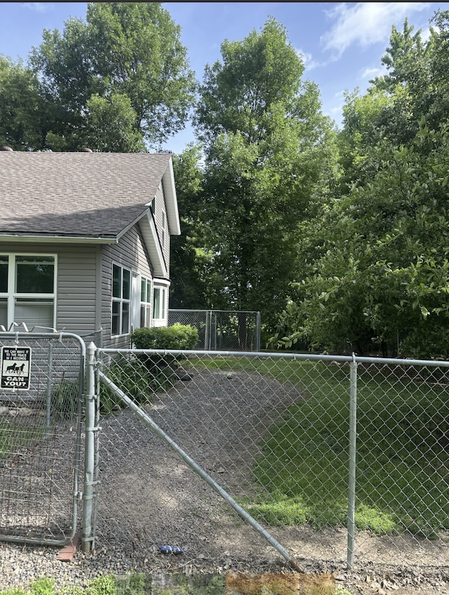 2021 Main St S, Pine City Twp, MN 55063 - view of property exterior with a shingled roof and a gate