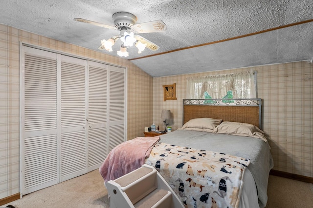 2021 Main St S, Pine City Twp, MN 55063 - bedroom with wallpapered walls, a closet, a textured ceiling, carpet floors, and lofted ceiling