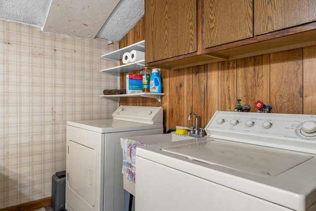 2021 Main St S, Pine City Twp, MN 55063 - washroom with cabinet space, independent washer and dryer, wallpapered walls, and wooden walls